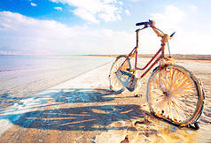 Bike rusting on the shore